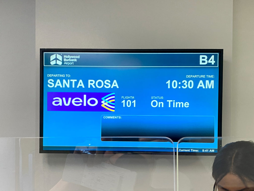 A gate information display sign at Hollywood Burbank Airport's gate B4 announces information for Avelo Airlines’ first passenger flight, XP101. The trip traveled from Hollywood Burbank Airport in Burbank, California (BUR) to Charles M. Schulz–Sonoma County Airport in Santa Rosa, California (STS) on Wednesday, April 28, 2021.