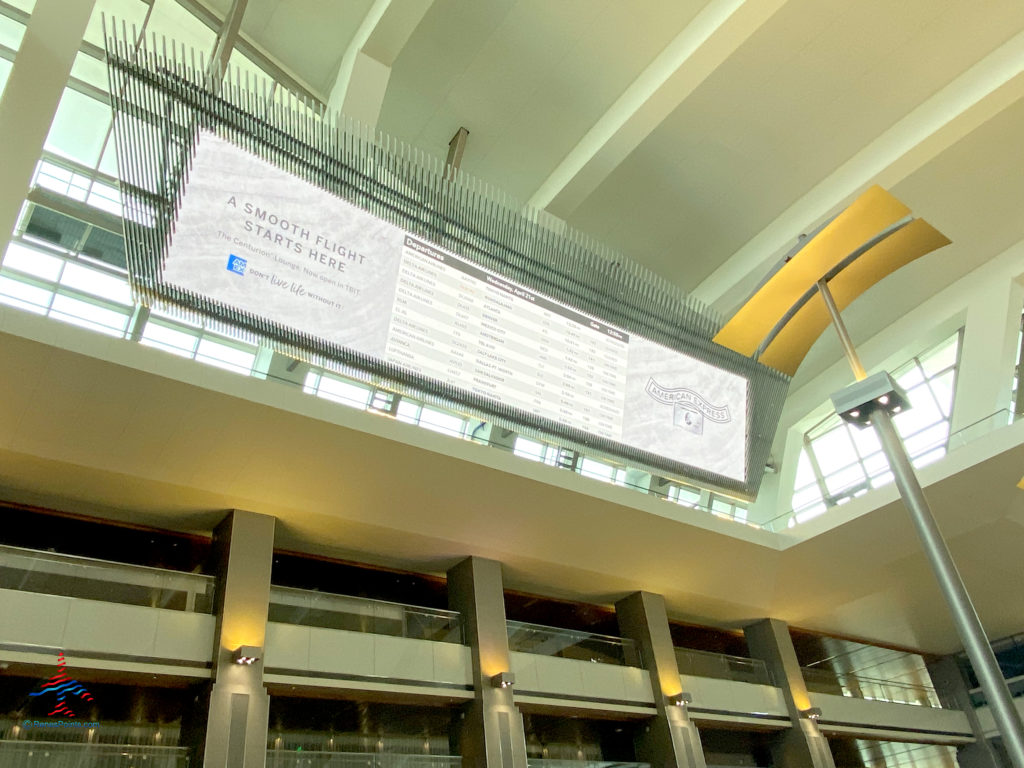 A departures board with American Express branding is seen inside the Tom Bradley International Terminal (TBIT) at Los Angeles International Airport in Los Angeles, CA. (©Chris Carley/RenesPoints.com)