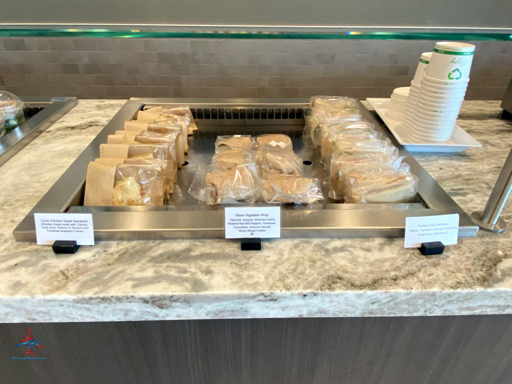 Pre-packaged curry chicken salad sandwiches, Italian vegetable wraps, and turkey club sandwiches are seen during a visit to the Delta Sky Club Salt Lake City inside Terminal A of Salt Lake City International Airport (SLC). (Photo ©RenesPoints.com)