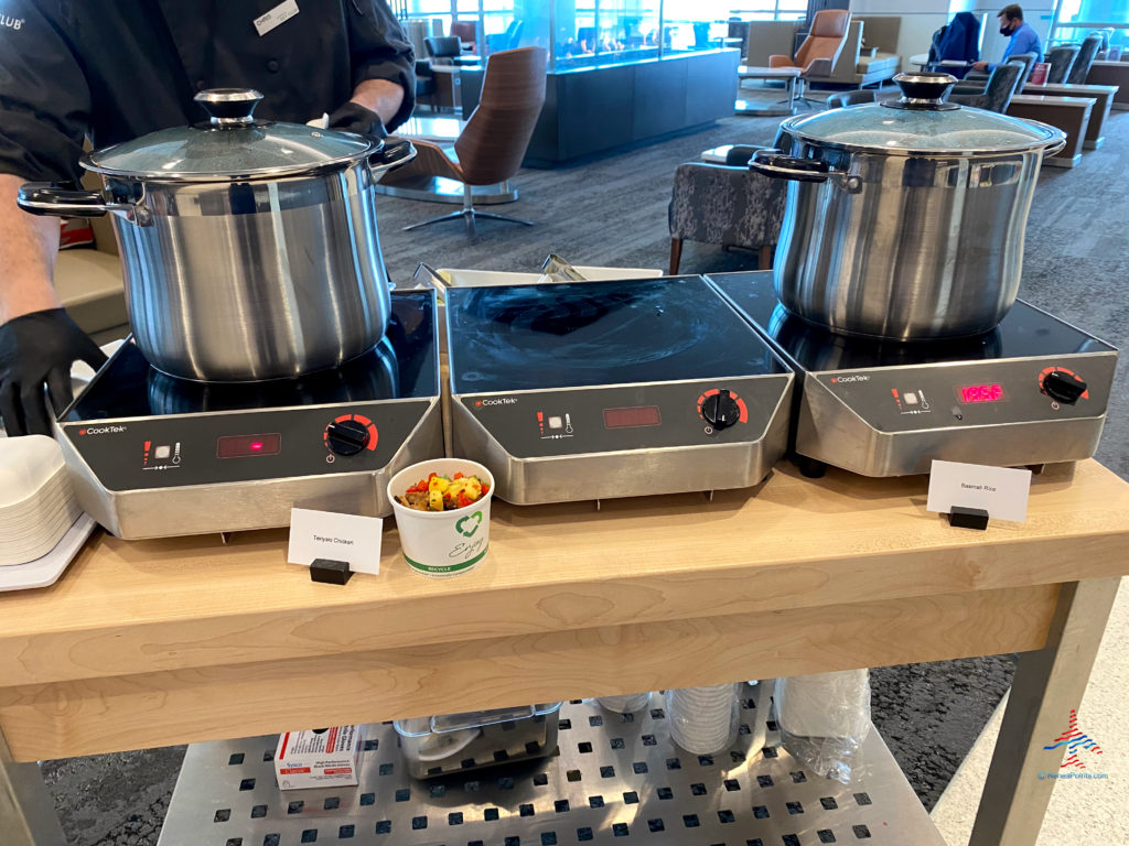 A portable chef's table serving chicken teriyaki and basmati rice is seen during a visit to the Delta Sky Club Salt Lake City inside Terminal A of Salt Lake City International Airport (SLC). (Photo ©RenesPoints.com)