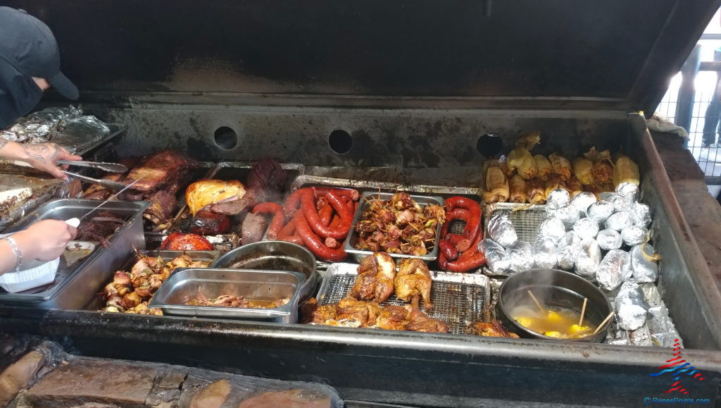 a large grill with meat and vegetables