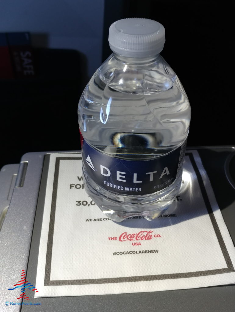 a bottle of water on a napkin