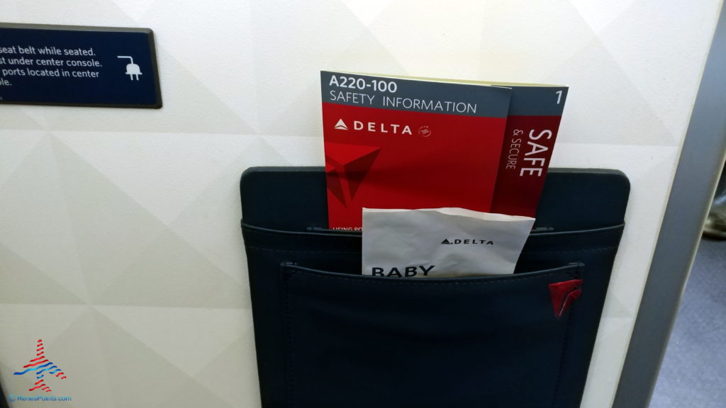 a pocket with a few brochures and a packet