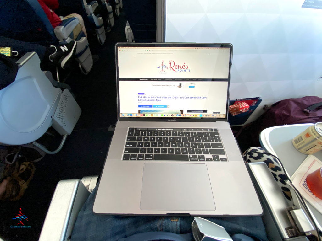 A 2019 Apple MacBook Pro is used during a flight.