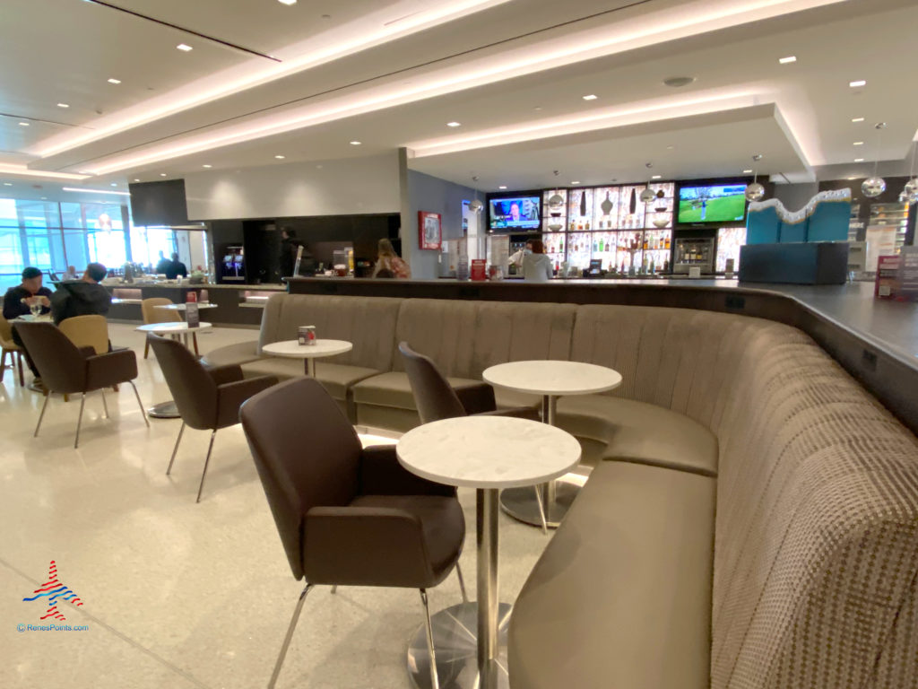 Cafe-style seating and a bar are seen during a visit to the Delta Sky Club Salt Lake City inside Terminal A of Salt Lake City International Airport (SLC). (Photo ©RenesPoints.com)