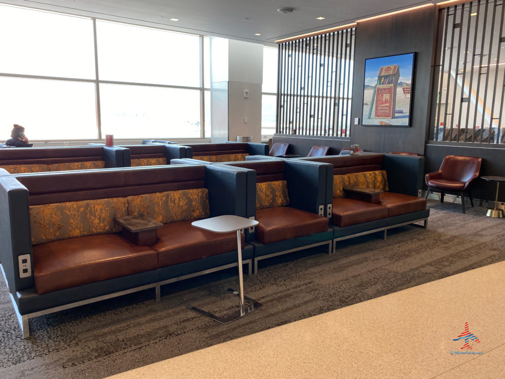 Sofas and tables are seen during a visit to the Delta Sky Club Salt Lake City inside Terminal A of Salt Lake City International Airport (SLC). (Photo ©RenesPoints.com)