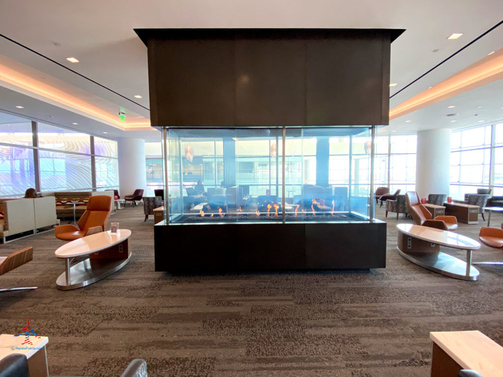 A fireplace and adjacent seating are seen during a visit to the Delta Sky Club Salt Lake City inside Terminal A of Salt Lake City International Airport (SLC). (Photo ©RenesPoints.com)
