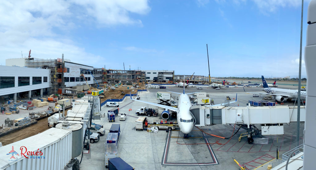 A panoramic view from the Delta Sky Club at LAX Terminal 2 reveals the Sky Way project construction between T2 and Terminal 3.