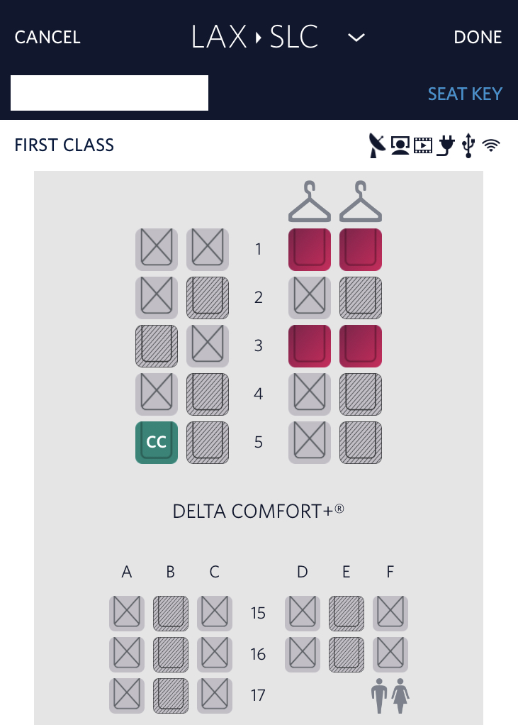 First class with an open adjacent seat on a Delta flight from Los Angeles to Salt Lake City.