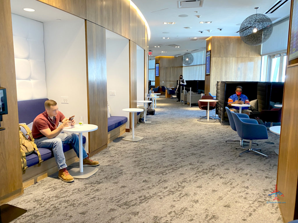 people sitting at tables in a room