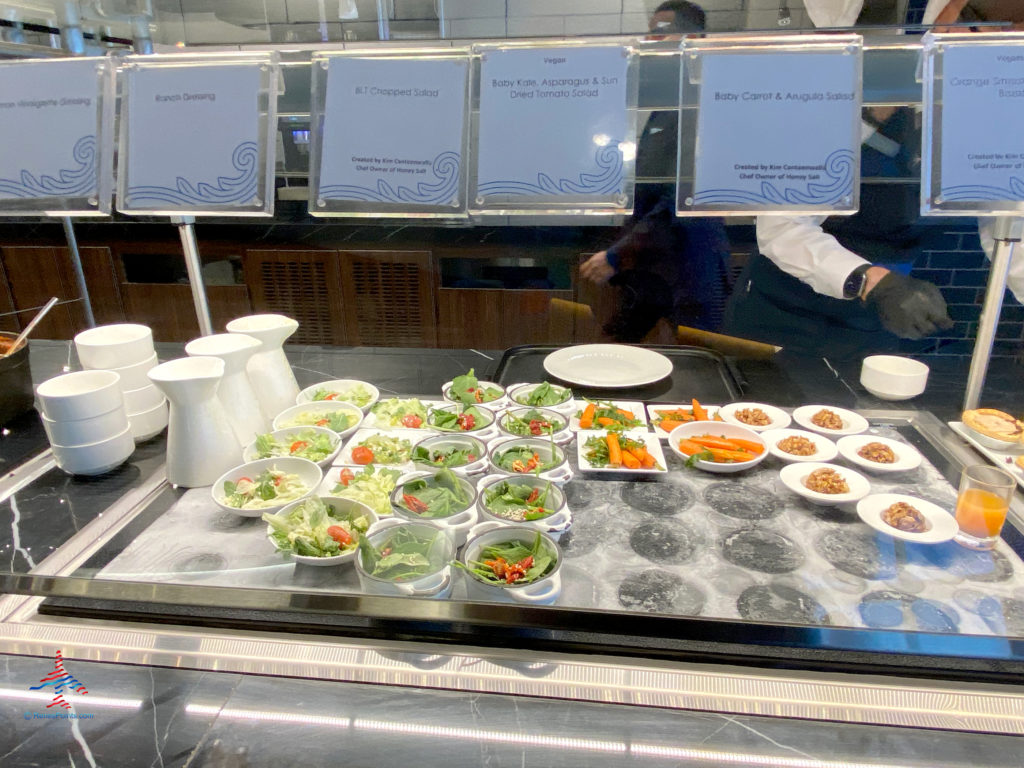 A BLT chopped salad; baby kale, asparagus, and sun dried tomato salad; baby carrot and arugula salad, and other options are seen on the buffet inside the dining area during a visit to American Express’ The Centurion Lounge - Las Vegas airport club lounge at Las Vegas International Airport (LAS) in Las Vegas, Nevada.