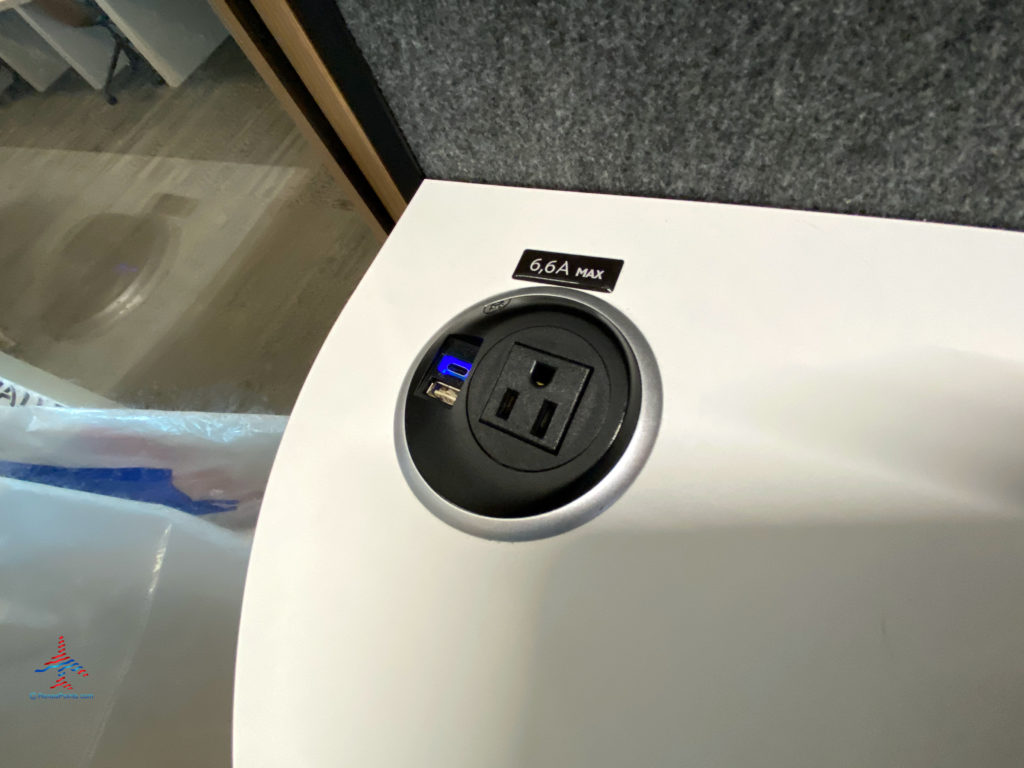USB and electrical ports are seen inside a cell phone booth during a visit to the Delta Sky Club Salt Lake City inside Terminal A of Salt Lake City International Airport (SLC). (Photo ©RenesPoints.com)