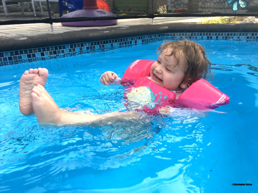Little girl swimming. Picture taken using a YOSH waterproof sleeve.